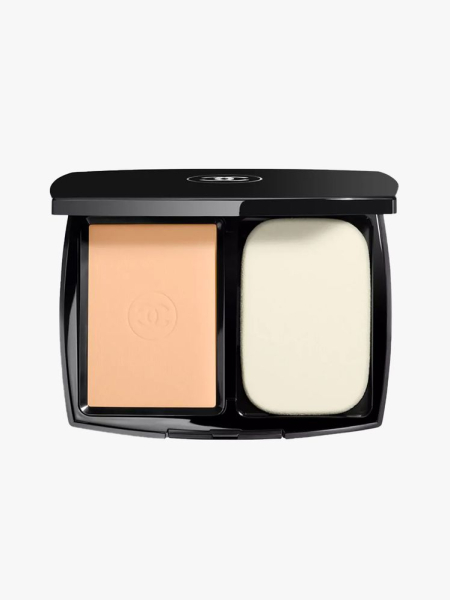 Chanel Ultra Le Teint Ultrawear All-Day Comfort Flawless Finish Compact Foundation top view of a black compact of powder foundation with sponge applicator on light gray background